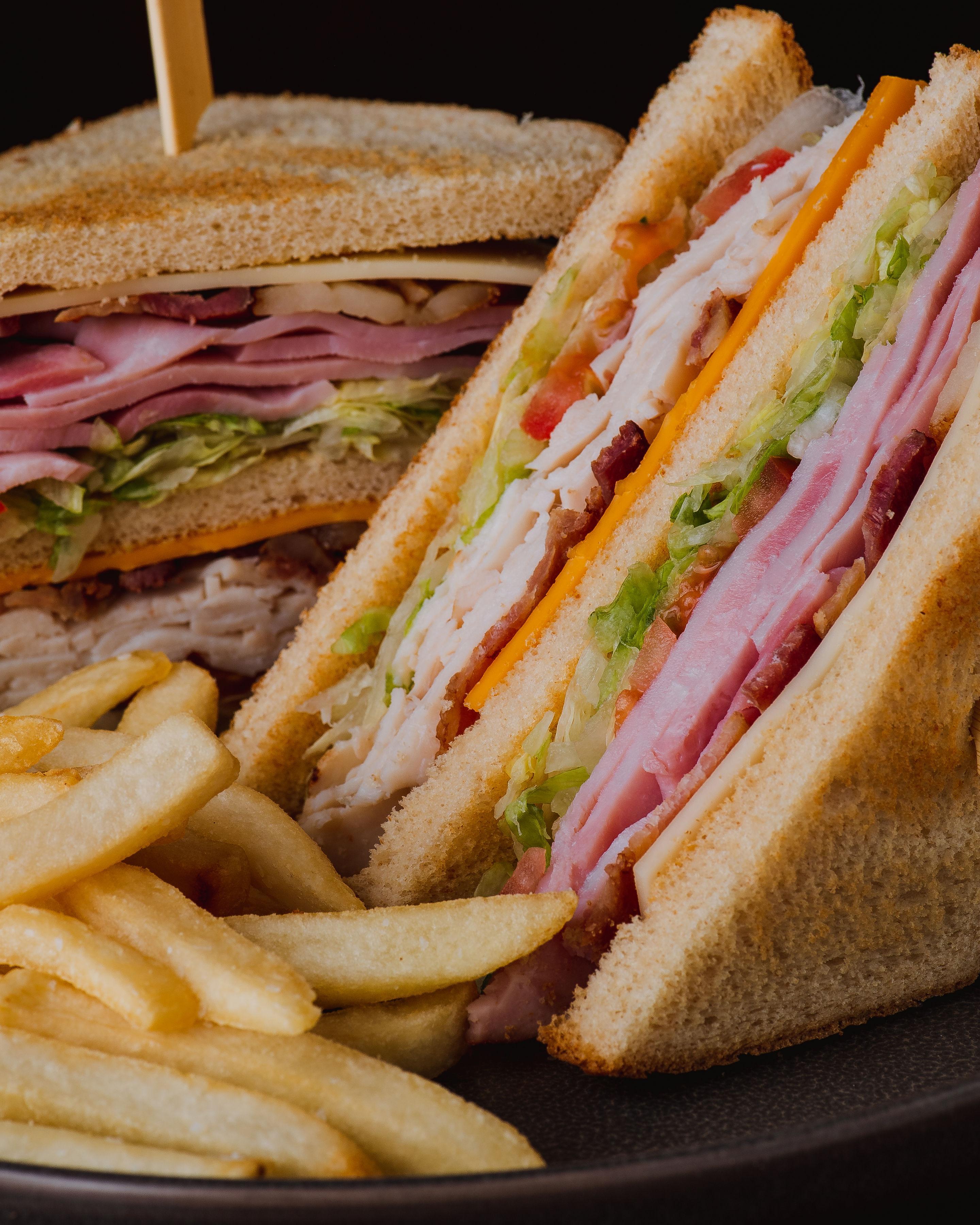 Triple-stack club sandwich with fries